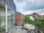 Ausblick Balkon - vermietete Maisonette-Wohnung mit Süd-Balkon & TG-Stellplatz in gepflegter Anlage