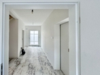 EG: Blick in den Flur - Erstbezug: Modernes Reihenhaus mit 2 Bädern, Vorgarten, Stellplätzen & großem Gemeinschaftshof