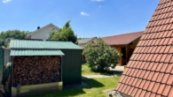 Modernes Zuhause im Niedrigenergiehaus - Provisionsfrei - Blick auf das erste Holzlager und auf das Grundstück